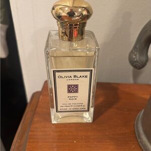 Olivia Blake Poppy Noir Eau de Toilette - Clear Bottle with Gold Cap